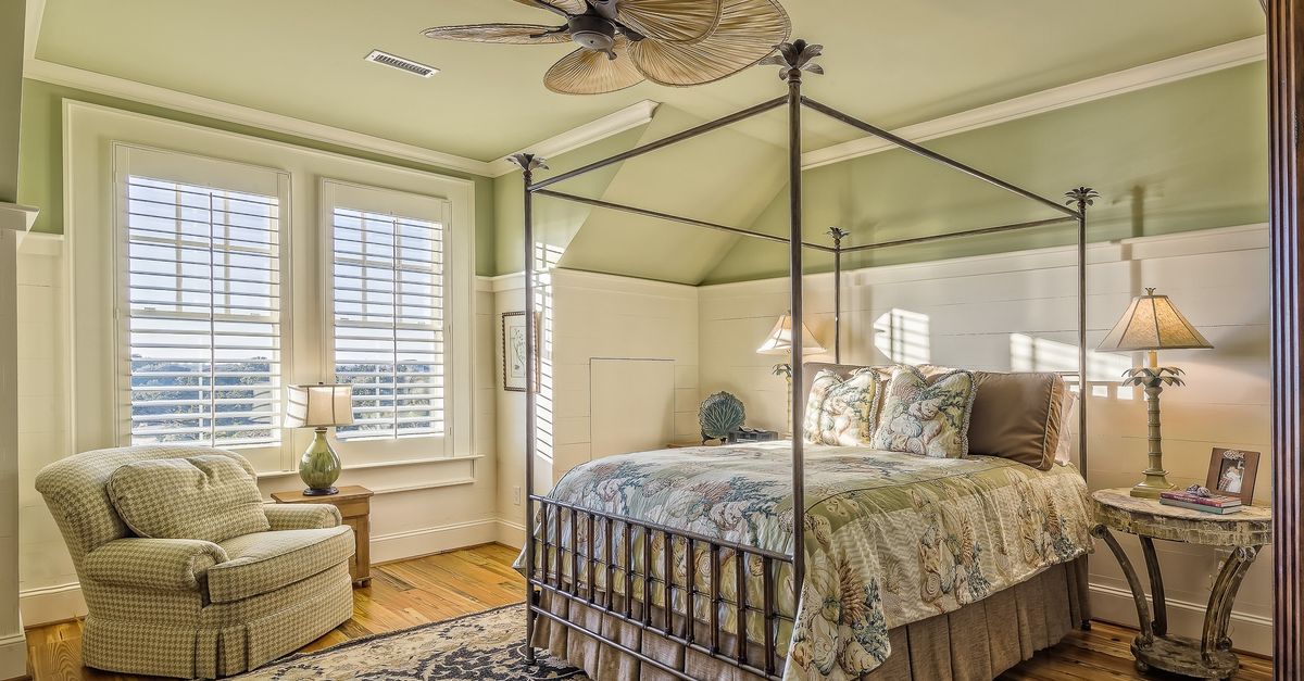 Small rug next to a floor lamp with warm light