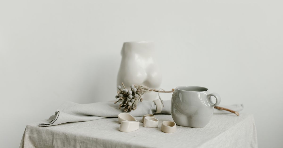 Ceramic cup resting on a light tablecloth