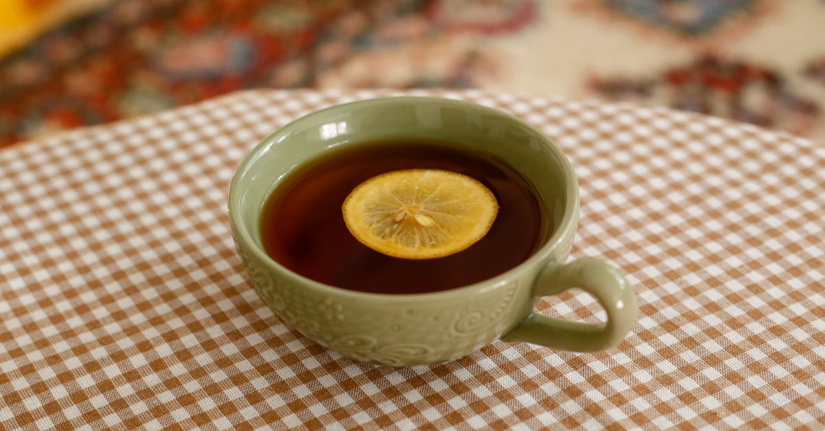 Olive ceramic cup with wheel marks on the wall